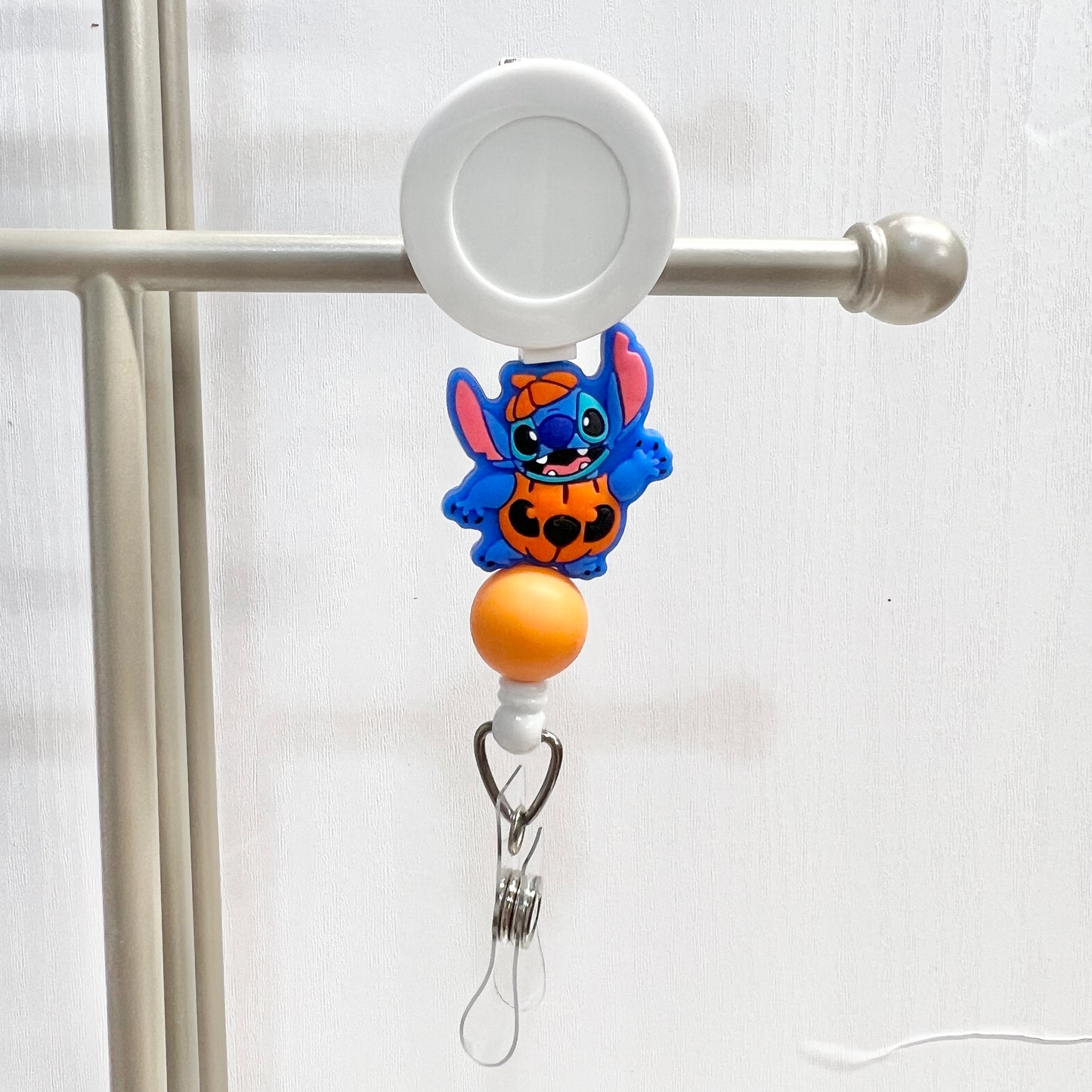 Pumpkin Blue Alien Badge Reel