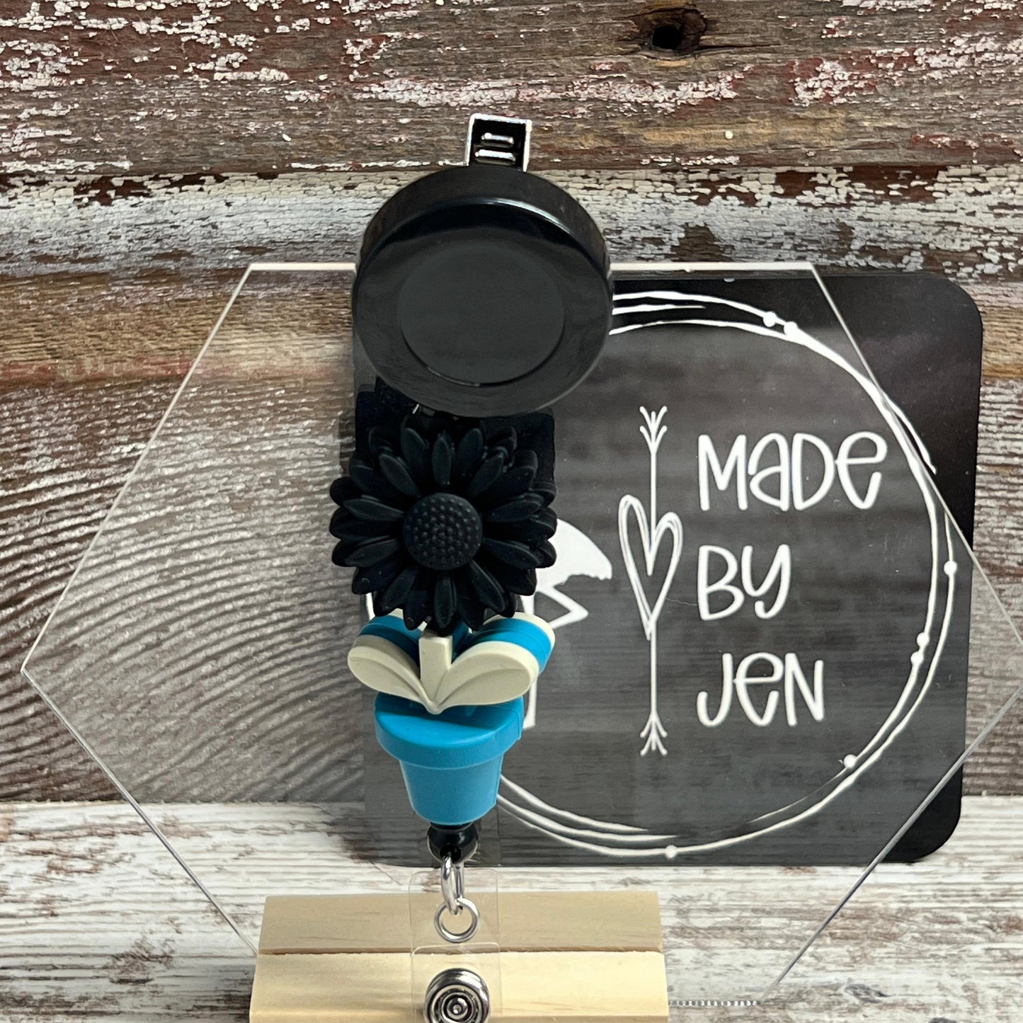 Black Daisy w-Teal Bloom Badge Reel