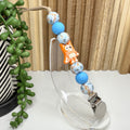 Orange Dog Pacifier Clip