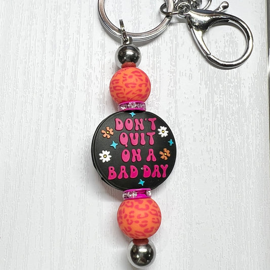 Don’t Quit Bright Leopard Silver Keychain Bar