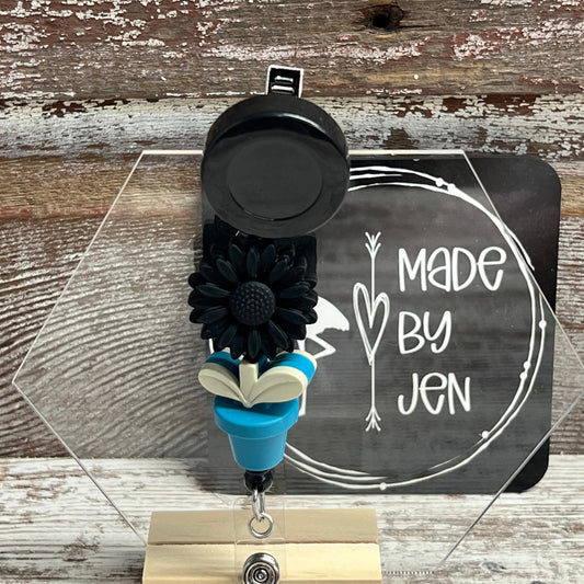 Black Daisy w-Teal Bloom Badge Reel